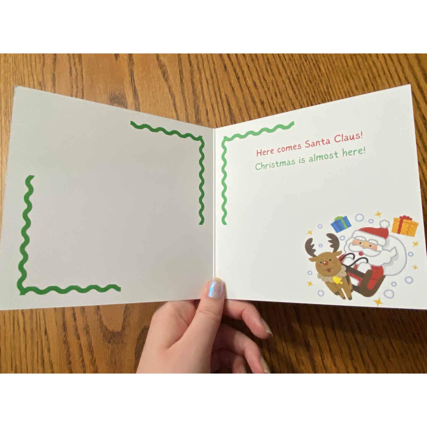 Christmas greeting card with Christmas tree and Santa with his sleigh, envelope included