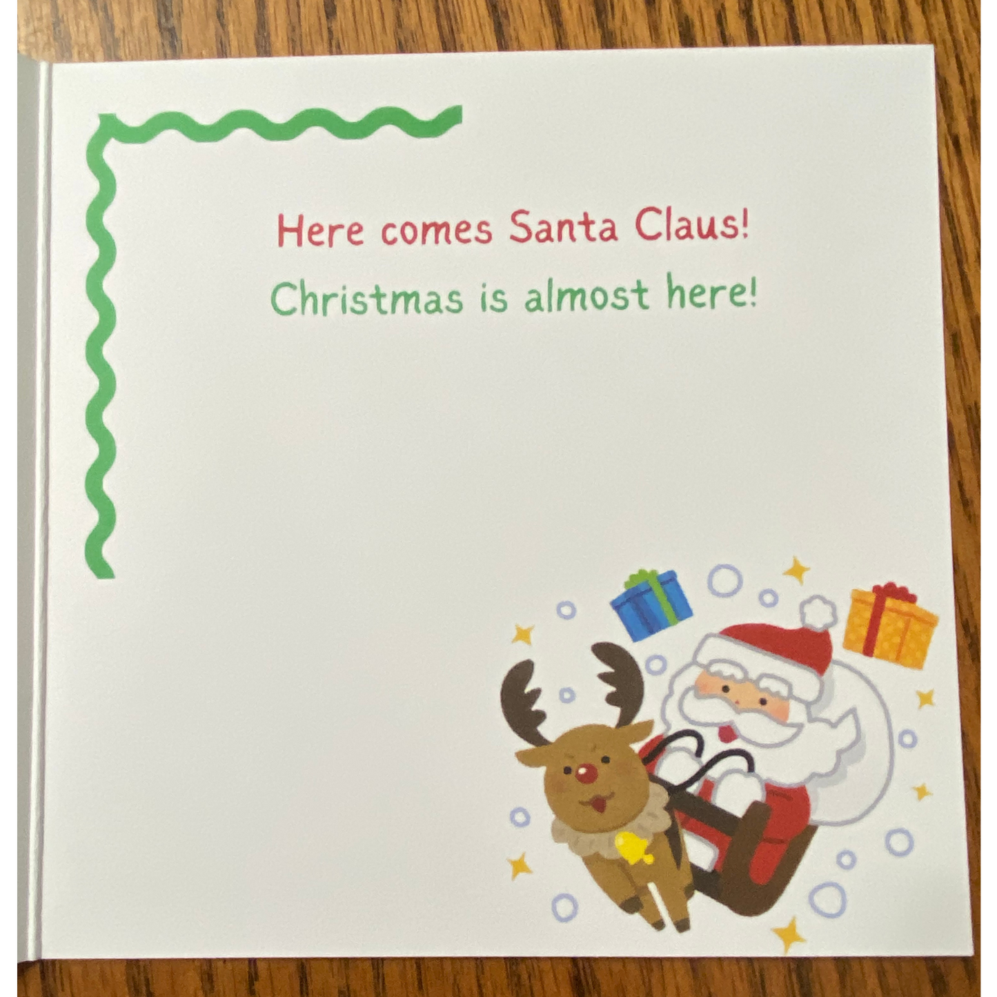 Christmas greeting card with Christmas tree and Santa with his sleigh, envelope included